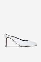 White Lana heels by 10th Floor featuring sleek stiletto design and pointed toes, stylishly displayed on a neutral background.
