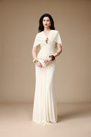Elegant ivory gown by Jenny K Tran featuring flowing fabric and intricate details, perfect for formal occasions.