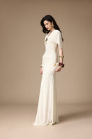 Elegant ivory gown by Jenny K Tran featuring intricate details, perfect for formal occasions.