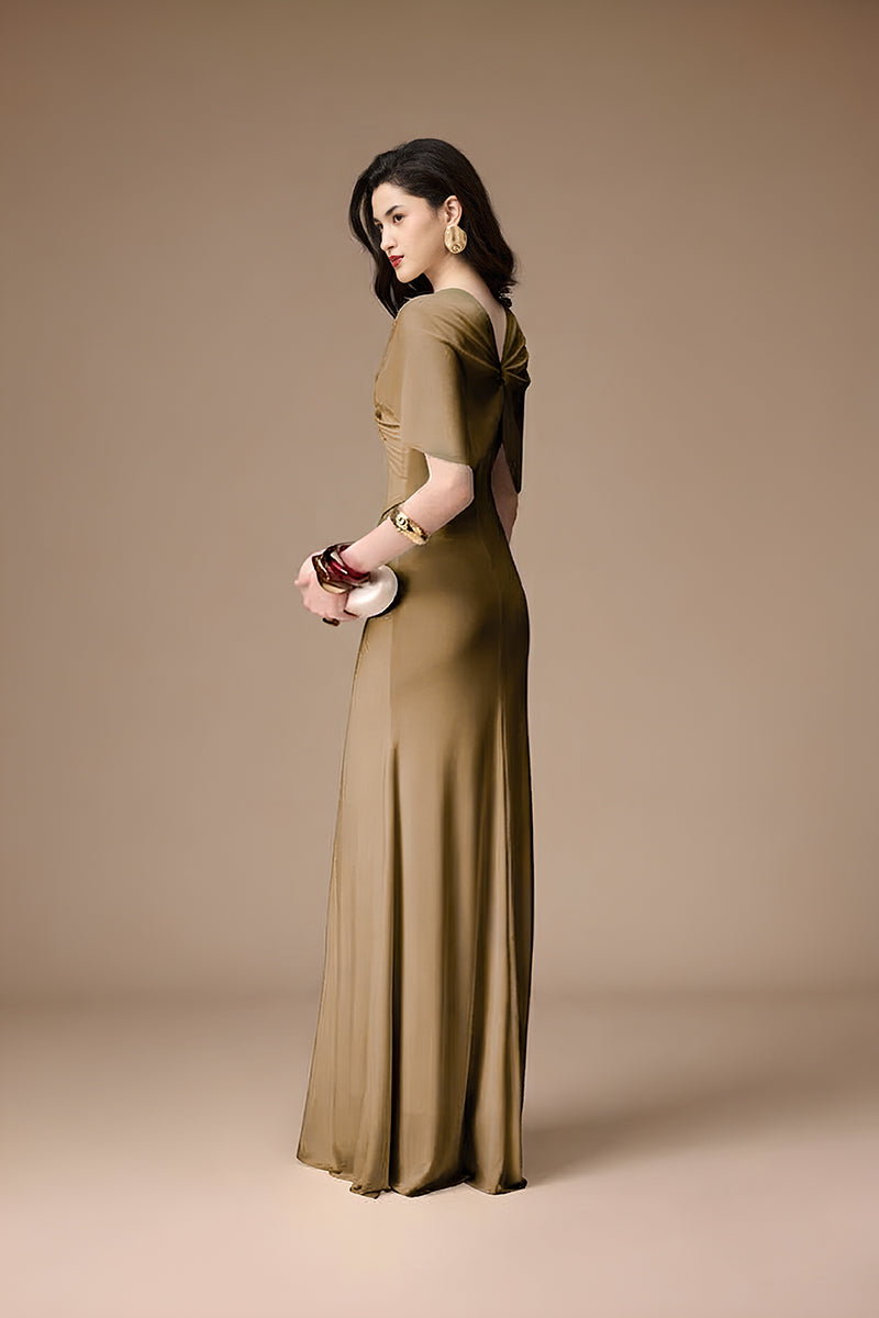 Elegant khaki gown by Jenny K Tran from the La Perla collection, featuring flowing fabric and intricate detailing.