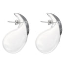 Large drop glass earrings by MAZ Manuela Álvarez featuring translucent, elegant glass teardrops with metallic accents.