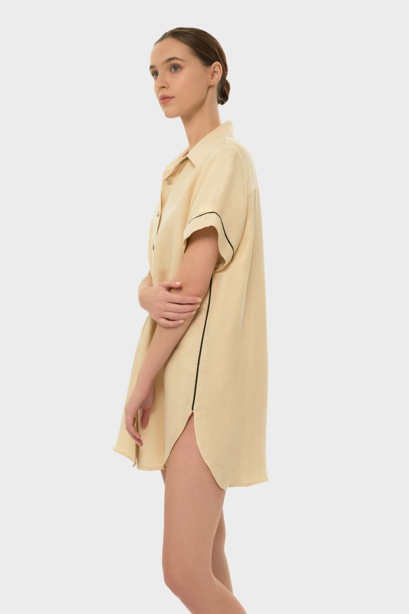niLuu AQUAFLORA Logan button-down shirt in creme, lightweight top with classic collar and long sleeves, shown on a hanger.