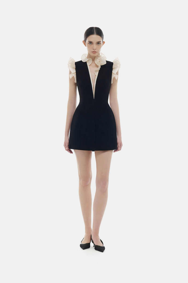 Black ruffle V-neck mini dress by Montsand, featuring a stylish mini dress design with ruffle details and V-neck neckline.