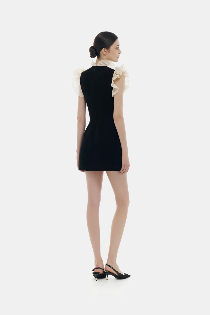 Black ruffle V-neck mini dress by Montsand, featuring a stylish ruffled neckline and short length, perfect for casual or dressy occasions.
