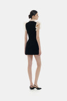 Black ruffle V-neck mini dress by Montsand, featuring a stylish ruffled neckline and short length, perfect for casual or dressy occasions.