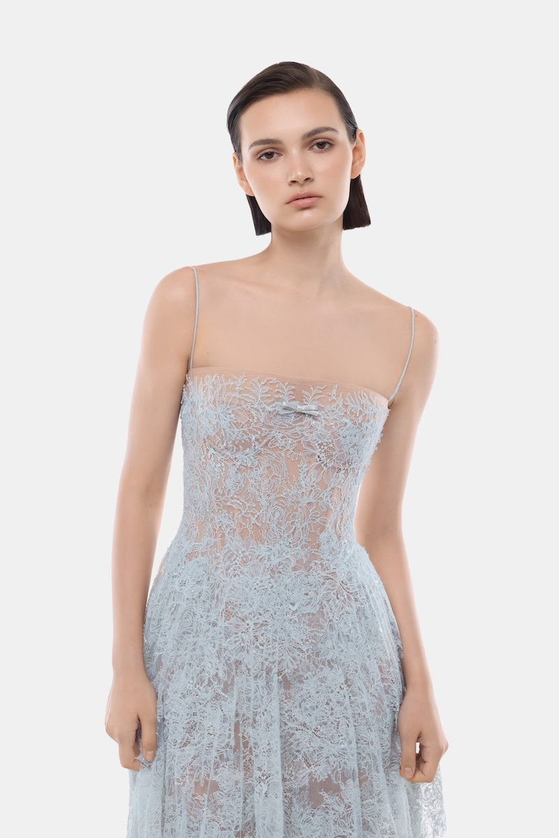 Blue straight neckline pleat gown by Montsand, flowing fabric with elegant pleats and a sleek silhouette.
