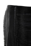 Black leather snake-like cord maxi skirt by MAZ Manuela Álvarez, featuring a flowing design and textured snake-inspired pattern.