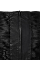 Black leather snake-like cord maxi skirt by MAZ Manuela Álvarez featuring a flowing, textured design and high waist style.