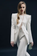 White Montpellier jacket by Lekieu, featuring a stylish, lightweight design with a zip-up front and collar.