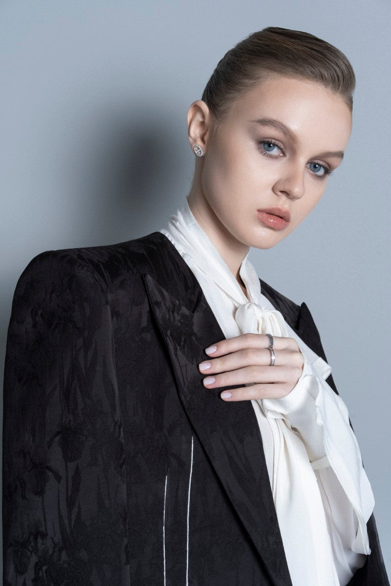 Black LEKIEU Grenoble jacket with a sleek, fitted design and zipper closure, suitable for casual or outdoor wear.