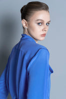 Blue Toulouse shirt by LEKIEU, featuring a classic collar and button-down front, displayed on a hanger.