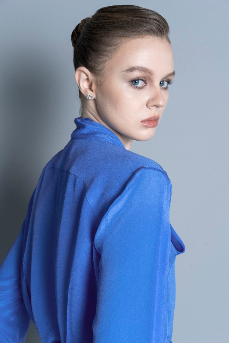 Blue Toulouse shirt by LEKIEU, featuring a classic collar and button-down front, displayed on a hanger.