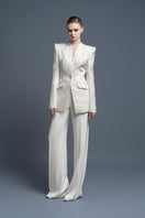 Cream Cardiff pants by Lekieu featuring a relaxed fit and stylish design, shown on a white background.