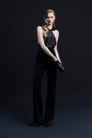 Black ELYSÉES jumpsuit by LEKIEU, featuring sleek design and fitted silhouette, shown on a model.