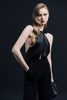 Black ELYSÉES jumpsuit by LEKIEU, featuring a sleek and modern design, displayed on a model with stylish accessories.