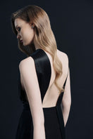 Black LEKIEU ELYSÉES jumpsuit shown on a model, featuring a sleek, fitted design with long sleeves and stylish details.