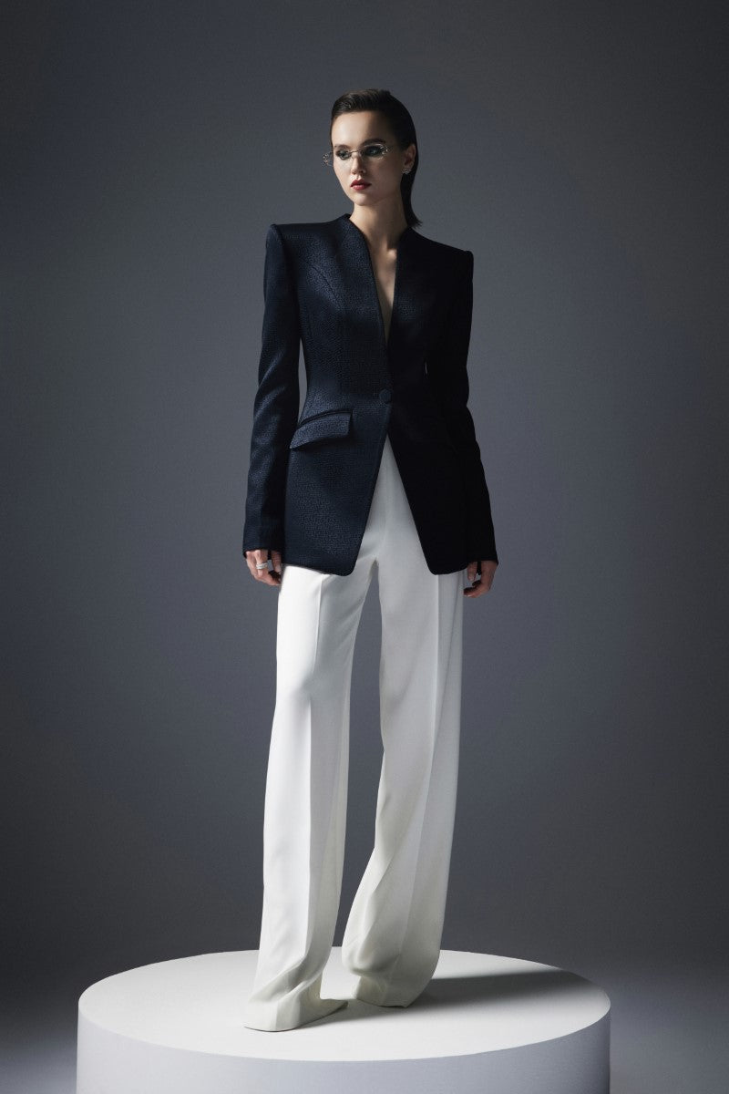 Black Lekieu Badajoz jacket with a sleek design, shown on a model, highlighting the stylish fit and fabric details.