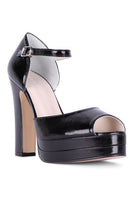 Black Terry de Havilland Lena platform heels with chunky heel and ankle strap, styled on a neutral background.