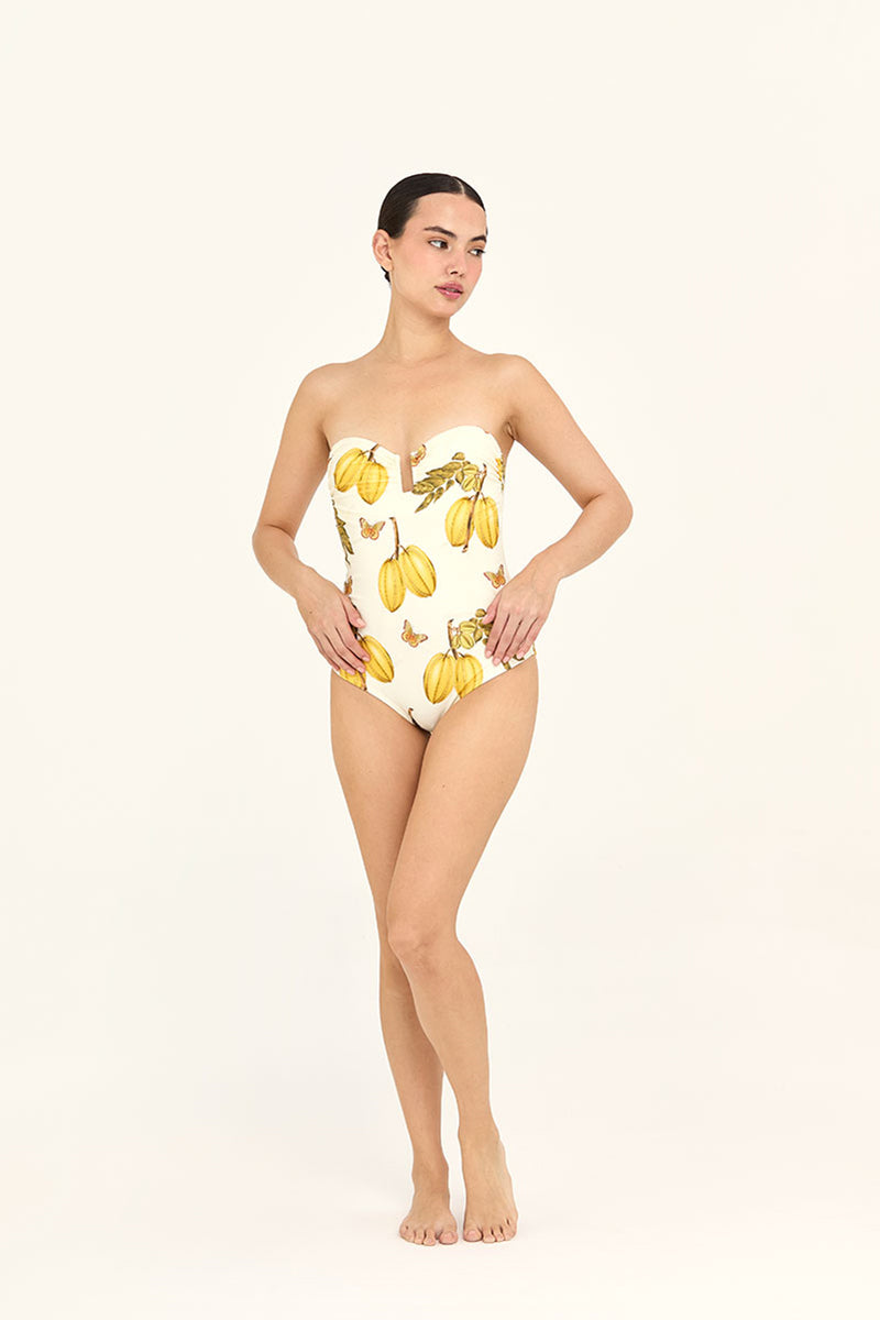 Aguaclara L'Est one-piece swimsuit in vibrant pattern, fitted design with scoop neckline and full back, suitable for beachwear.