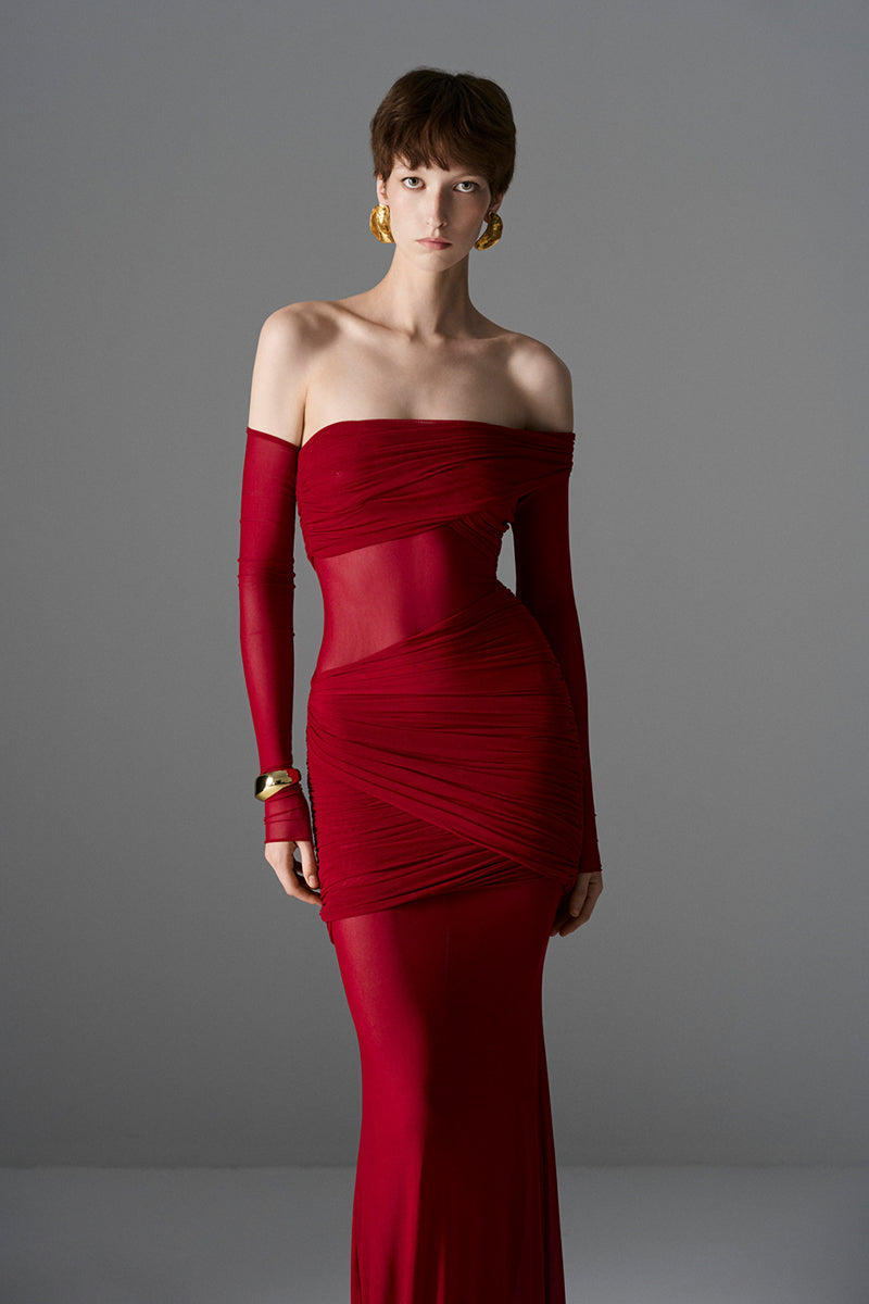 Elegant Crimson Aphrodite gown by Le Thanh Hoa, flowing fabric with intricate design, perfect for formal occasions.
