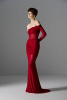 Elegant crimson Aphrodite gown by Le Thanh Hoa featuring flowing fabric and intricate detailing.