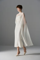 Le Thanh Hoa Cloud Whisper Gown, elegant midi dress with flowing fabric and soft pastel colors, perfect for special occasions.