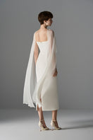 Elegant Le Thanh Hoa Cloud Whisper gown, midi dress with flowing fabric and soft pastel colors, perfect for formal occasions.