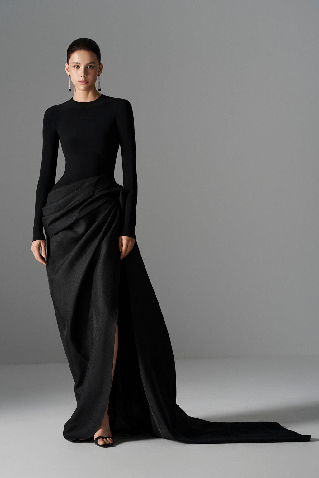 Elegant Serpentine Chic gown by Le Thanh Hoa featuring flowing fabric and intricate design, perfect for formal occasions.