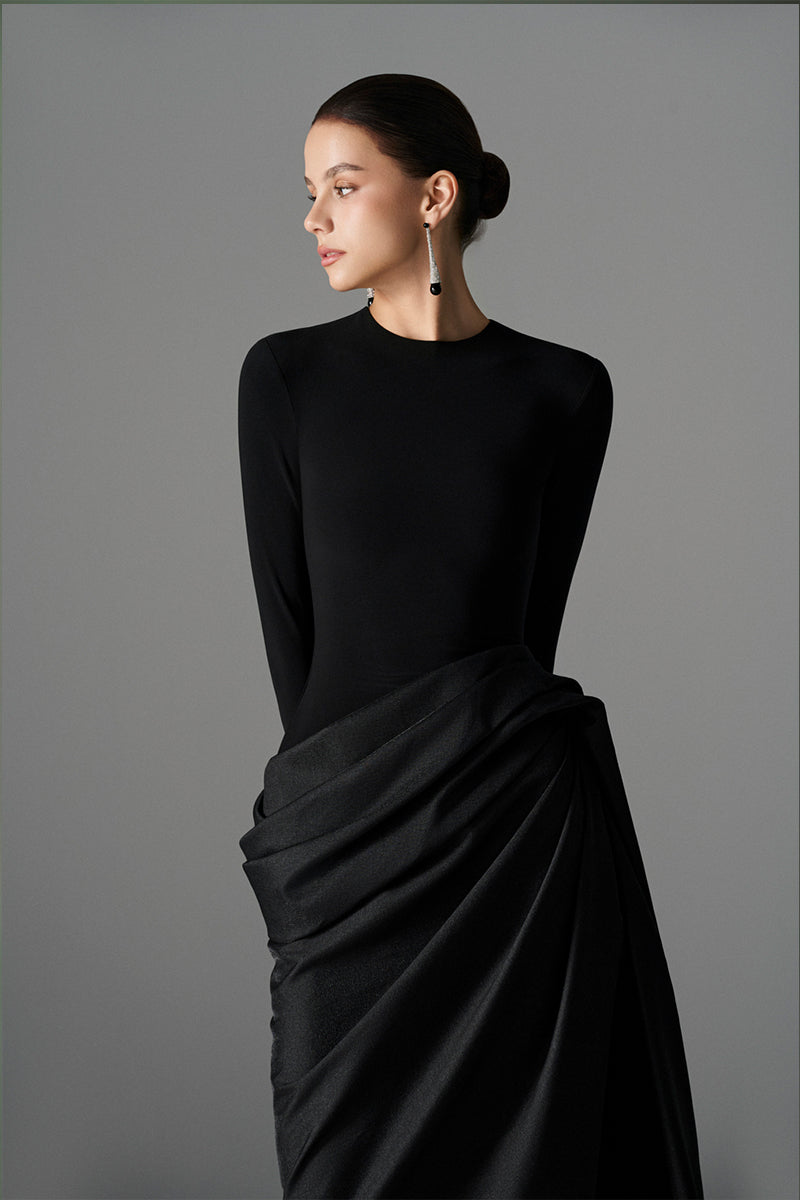 Elegant Le Thanh Hoa Serpentine Chic gown with flowing fabric and intricate design, perfect for formal occasions.