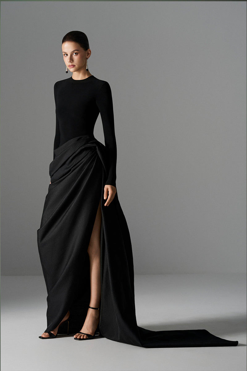 Elegant Le Thanh Hoa Serpentine Chic gown with flowing fabric and intricate detailing, perfect for formal occasions.