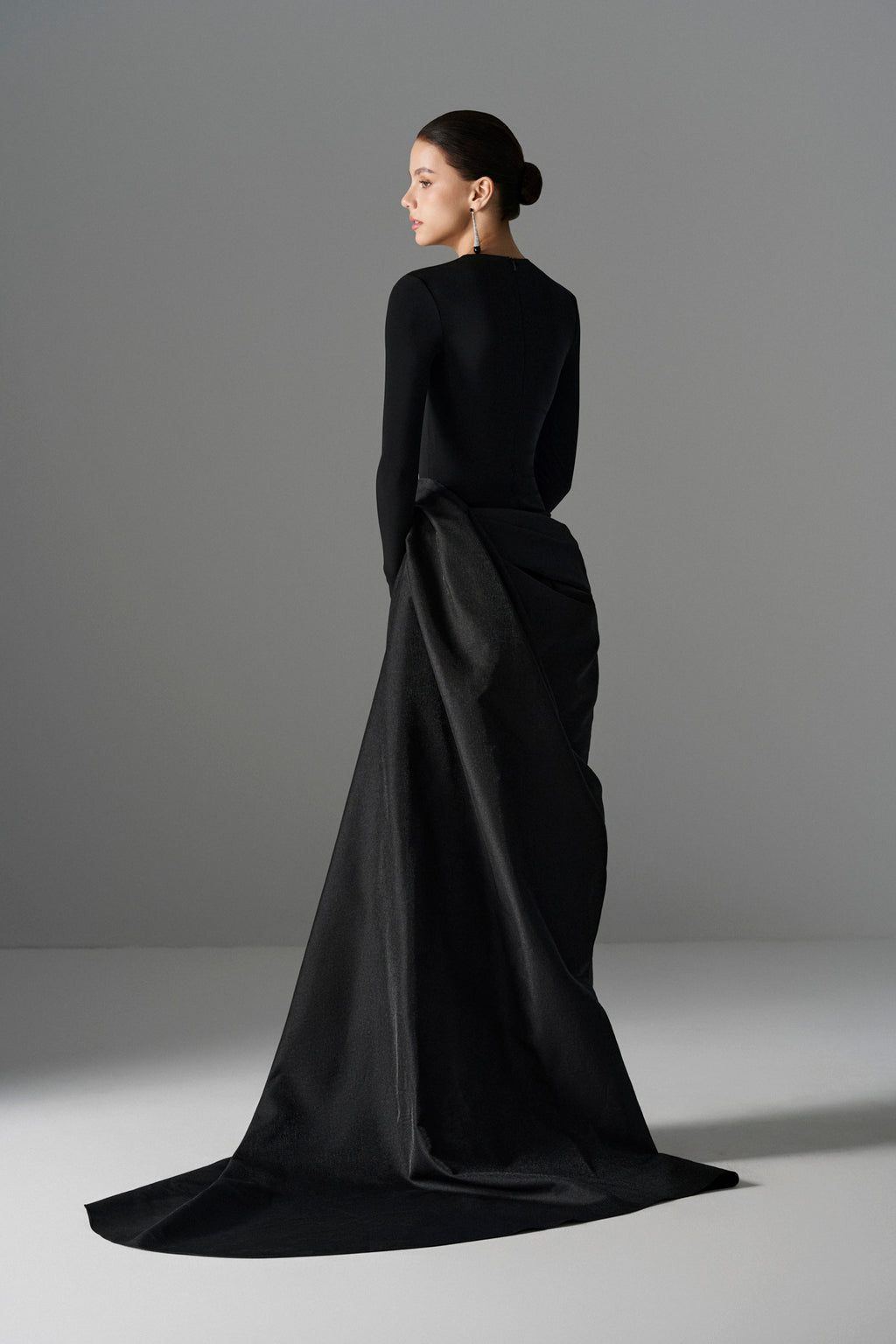 Le Thanh Hoa Serpentine Chic Gown featuring elegant flowing fabric and intricate design, perfect for formal occasions.