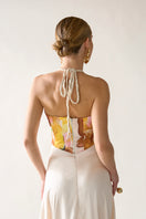 Tinta Latina floral Lettitop top, lightweight fabric with colorful floral pattern, short sleeves, and V-neck design.