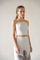 Tinta Latina ivory top featuring a stylish, sleeveless design with a V-neck and lightweight fabric, perfect for casual or dressy occasions.