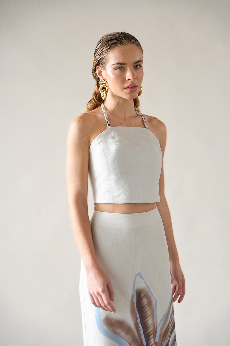 Tinta Latina ivory top featuring a stylish, sleeveless design with a V-neck and lightweight fabric, perfect for casual or dressy occasions.