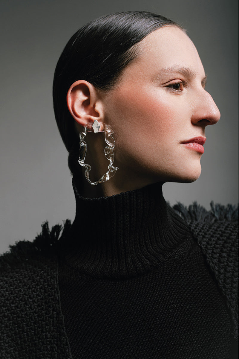 Silver glass hoops earrings by MAZ Manuela Álvarez featuring lichen-inspired design, shown in a close-up view.
