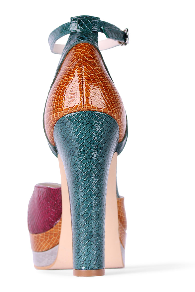 Terry de Havilland Lily London 70s platform heels with chunky soles and open toe design, in vibrant orange color.
