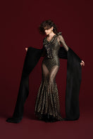 Black mermaid mesh maxi dress by Valenciani, featuring a fitted silhouette with elegant, flowing fabric and intricate mesh detailing.