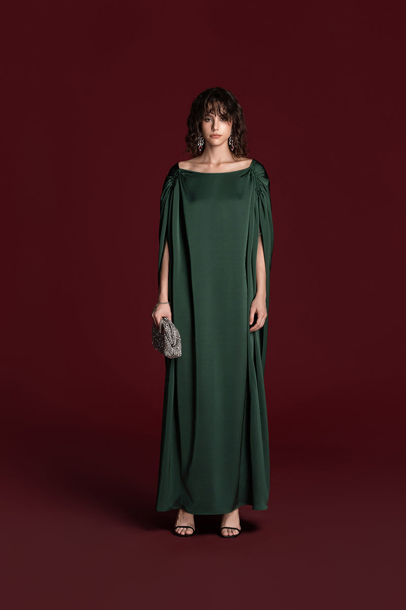 Green silk gown with drawstring shoulder detail by Valenciani, elegant and flowing style perfect for formal occasions.