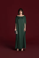 Green Valenciani silk gown with drawstring shoulder detail, elegant and flowing, perfect for formal occasions.