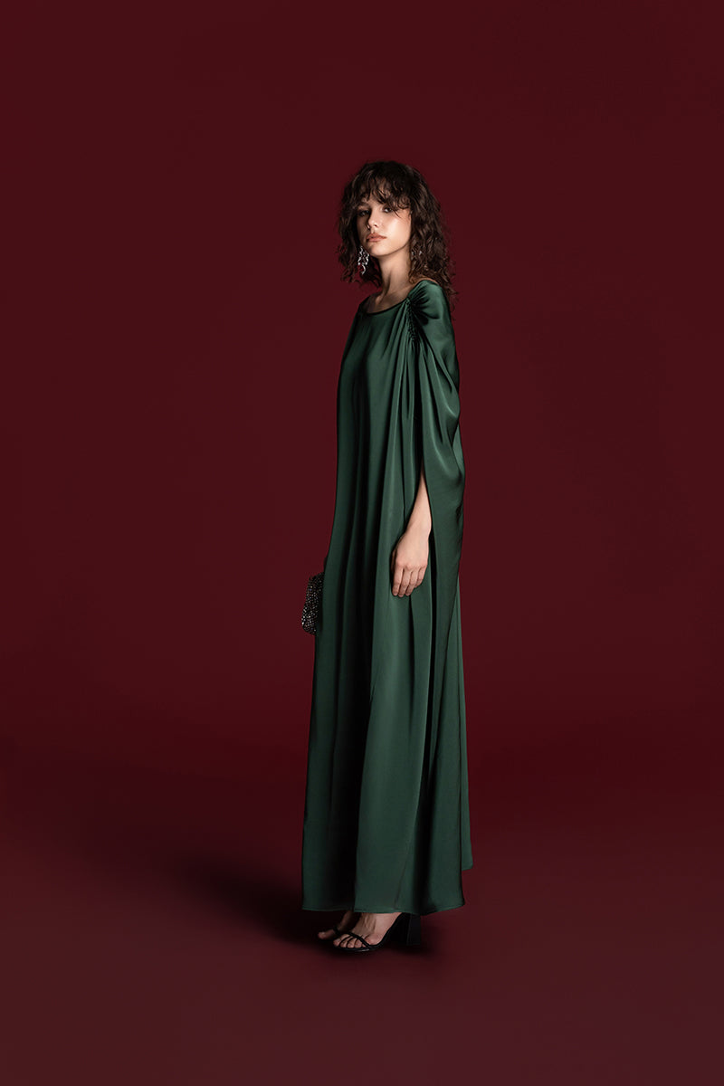 Green silk gown with drawstring shoulder detail from Valenciani, elegant and flowing, perfect for formal occasions.