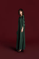 Green silk drawstring shoulder gown by Valenciani featuring elegant flowing fabric and a stylish silhouette.