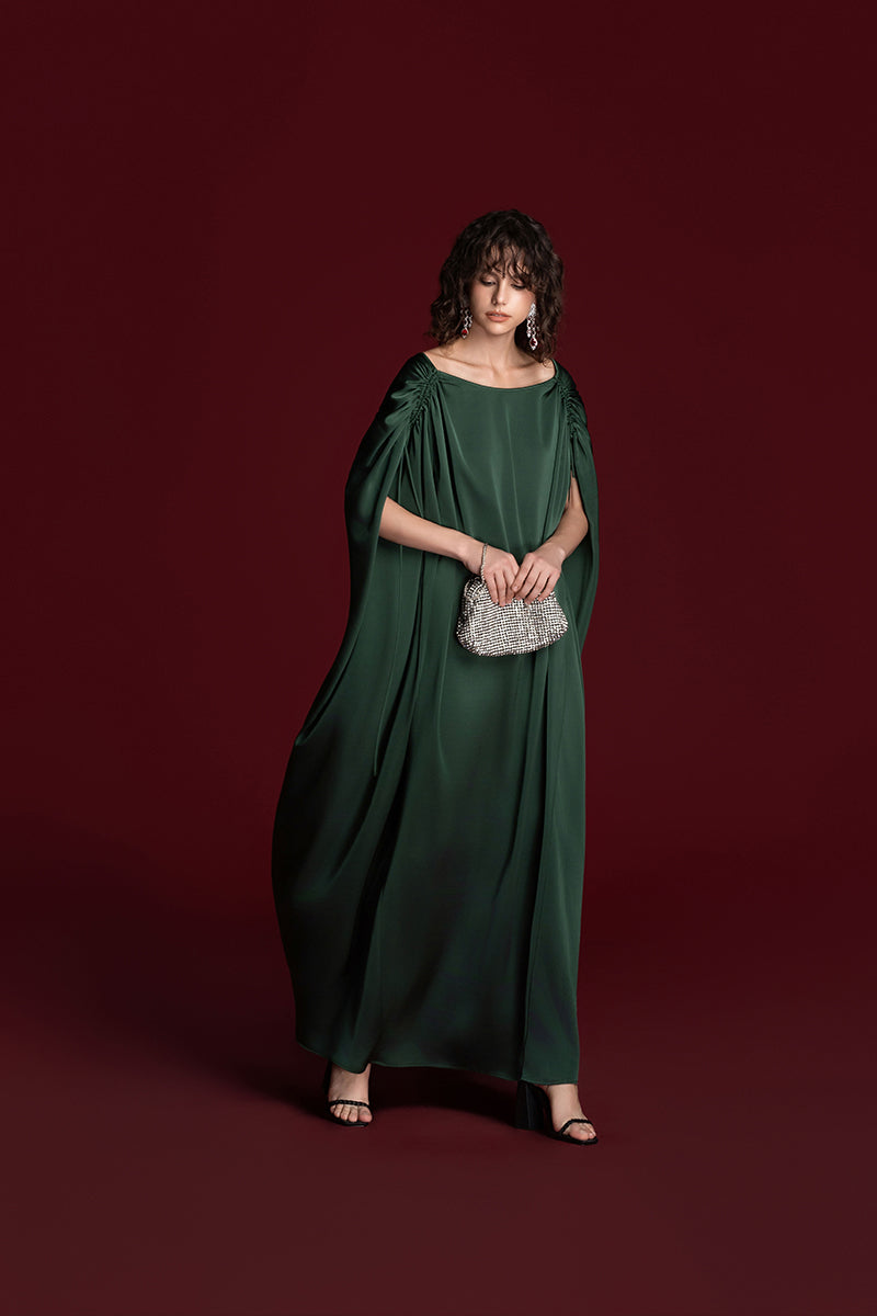 Green silk gown with drawstring shoulder detailing by Valenciani, elegant and flowing, perfect for formal occasions.