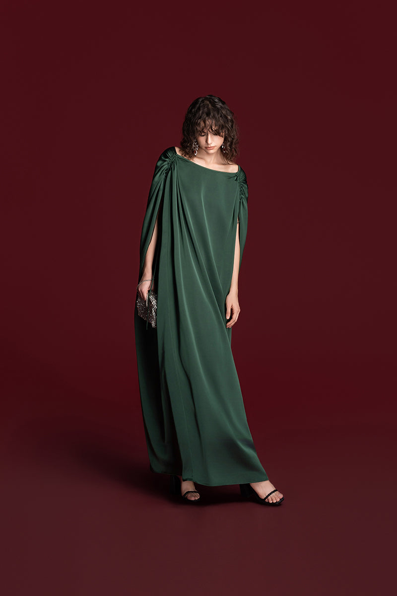 Green Valenciani drawstring shoulder silk gown with flowing fabric and elegant design, perfect for formal occasions.