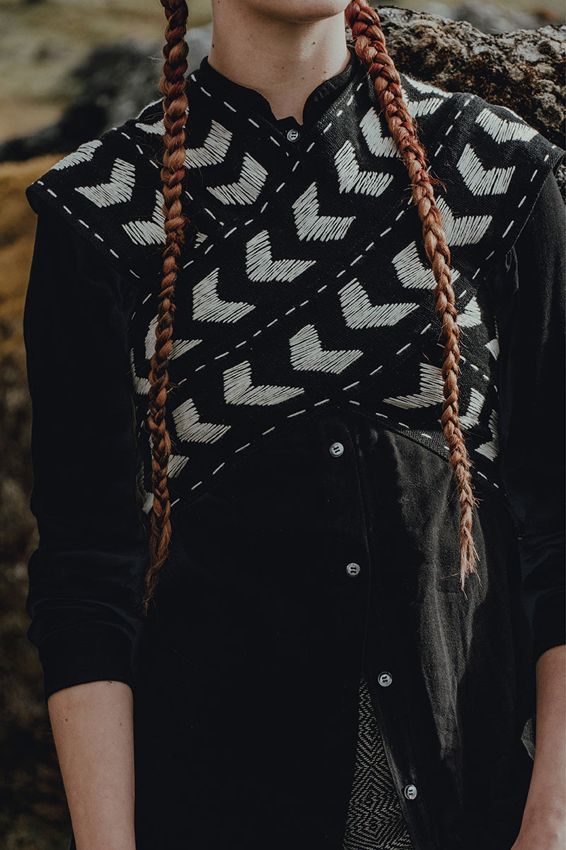 Maz Manuela Álvarez Loom Petal Crossed Top, stylish women's top with petal design and crossed details, shown on a model.