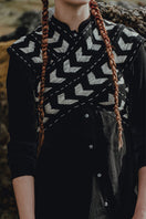 Maz Manuela Álvarez Loom Petal Crossed Top, stylish women's blouse with petal design and crossed details, shown on a model.