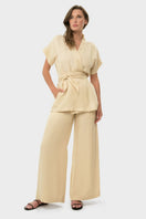 niLuu cream lounge pants with a relaxed fit, soft fabric, and elastic waistband, perfect for comfortable casual wear.