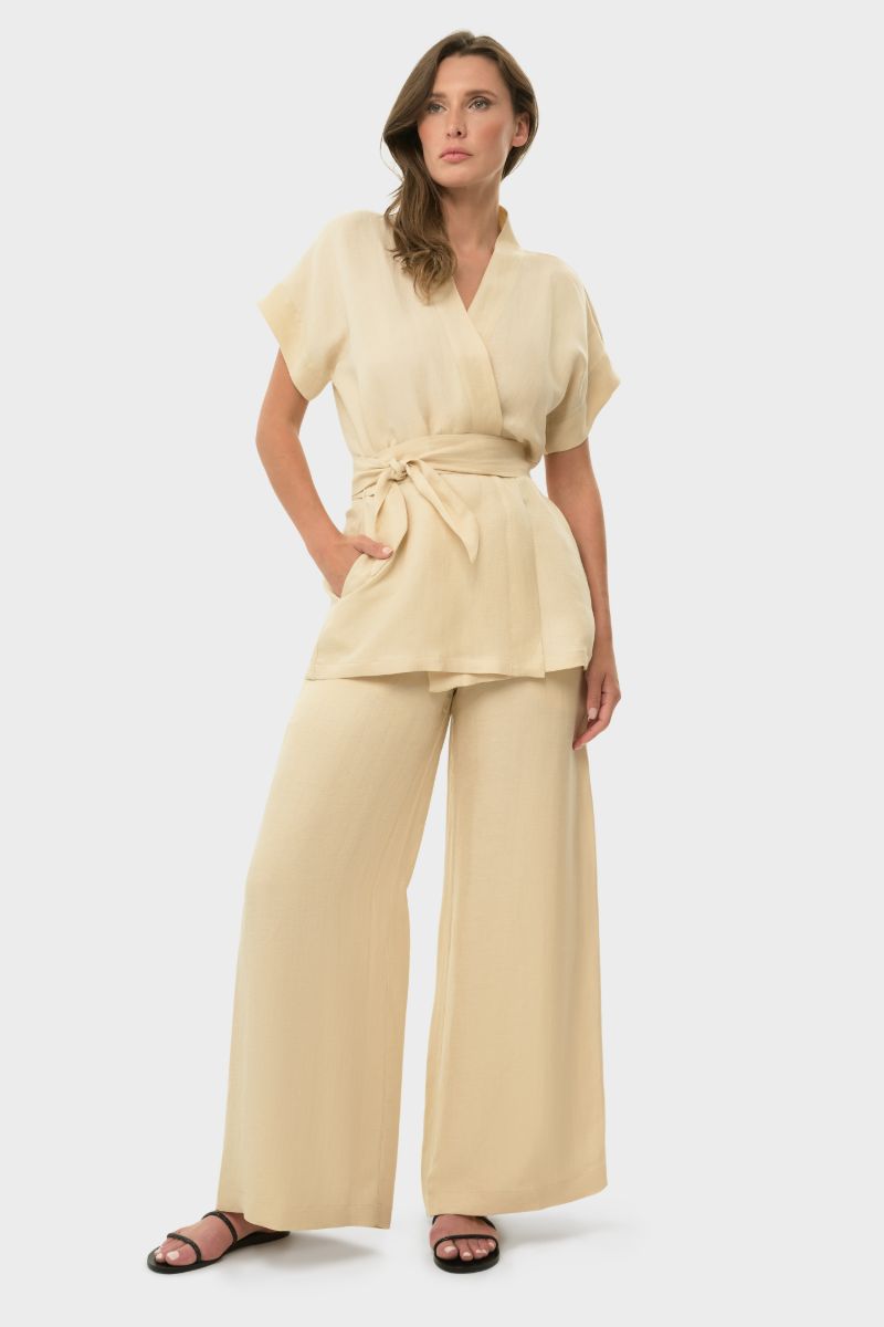 niLuu cream lounge pants with a relaxed fit, soft fabric, and elastic waistband, perfect for comfortable casual wear.