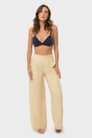 niLuu creme lounge pants displayed flat, showing soft fabric and relaxed fit for comfortable casual wear.