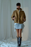 Lorena Saravia Katy Suede Jacket showing beige suede fabric with collar and front zipper detail.