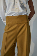 Lorena Saravia Isabela blouse, stylish shirt with intricate details, displayed on a hanger against a neutral background.